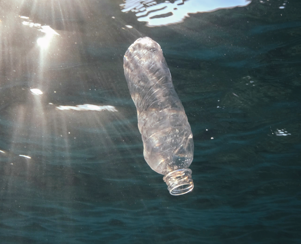 Underwater photography of a plastic bottle floating in open waters